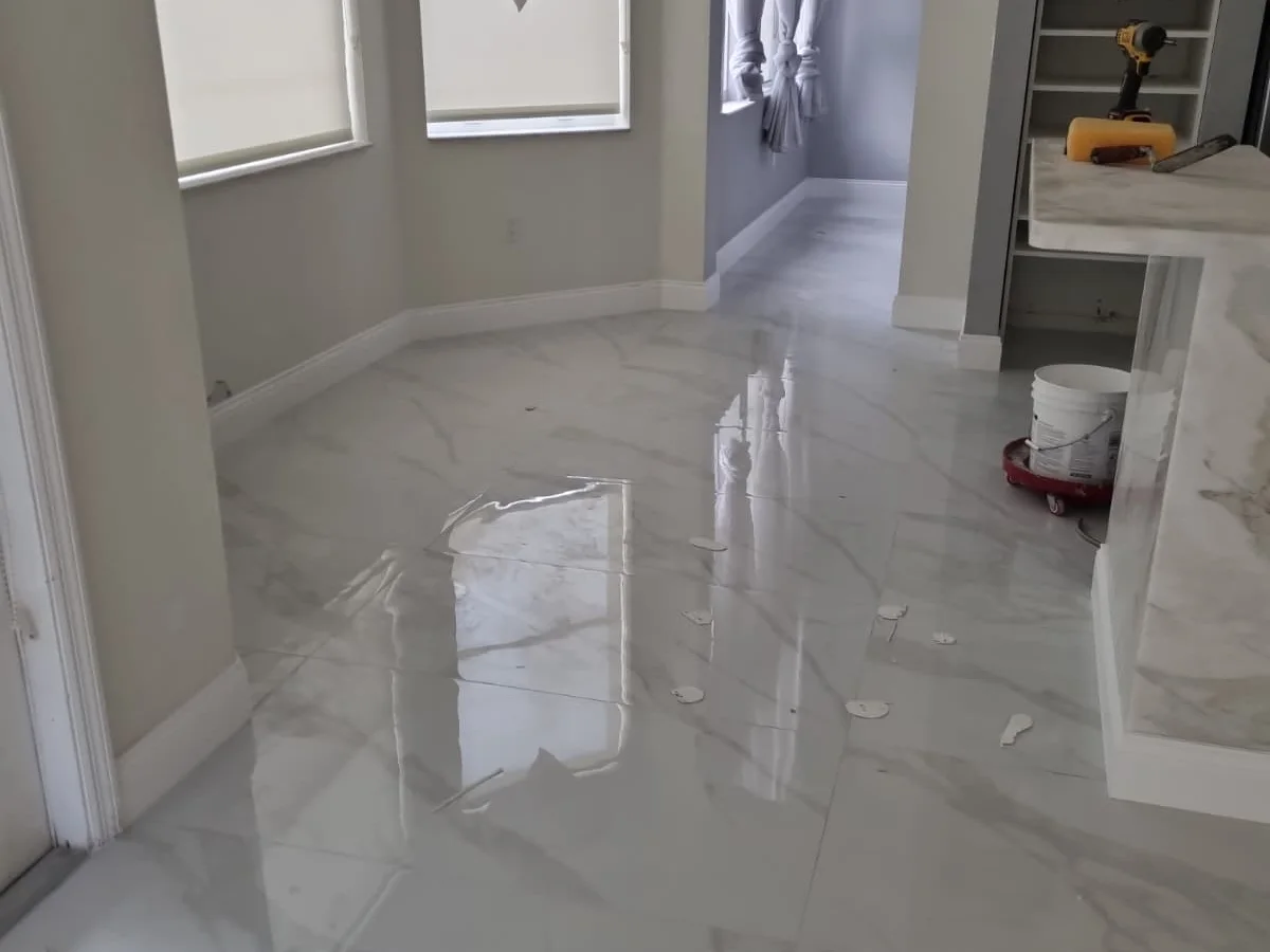 Glossy marble-look tile floor in a remodeled home