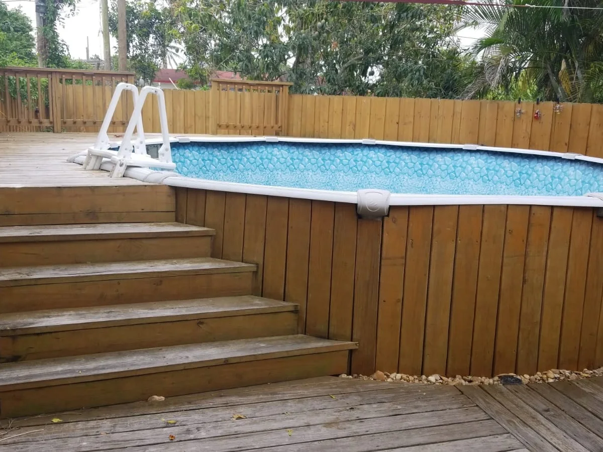 Wood deck built around an above-ground pool