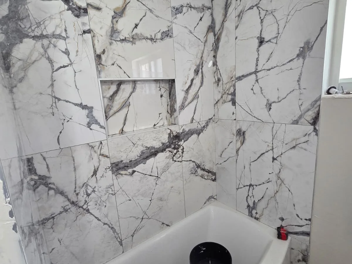 Marble-tiled walk-in shower we built
